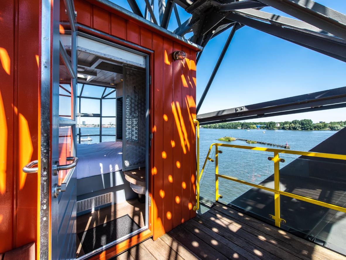 A panoramic bedroom view of the River IJ from The Yays