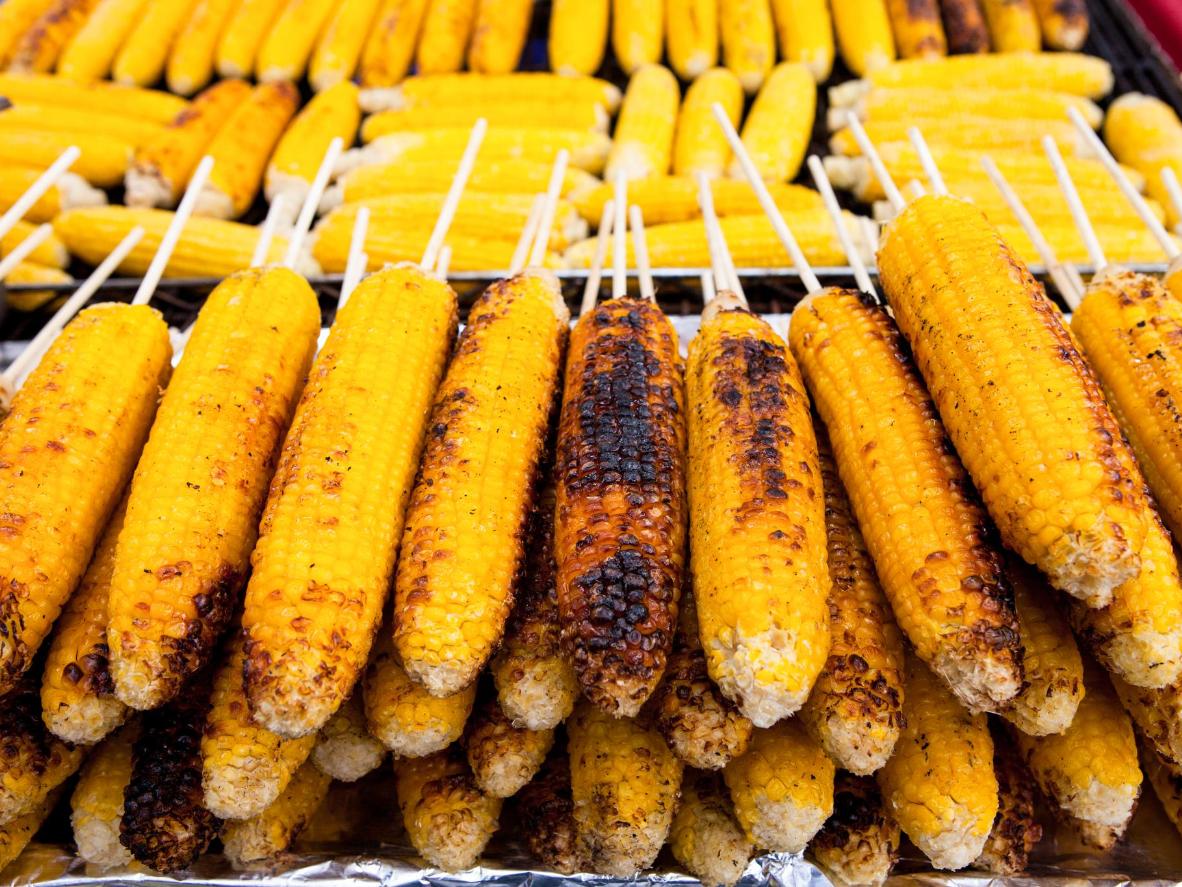 Tuck into festival street food like grilled corn-on-the-cob dripping with butter
