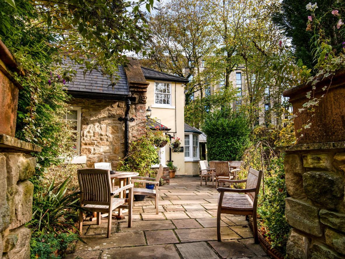 Relish the flower-filled country garden at The Kings Lodge Inn