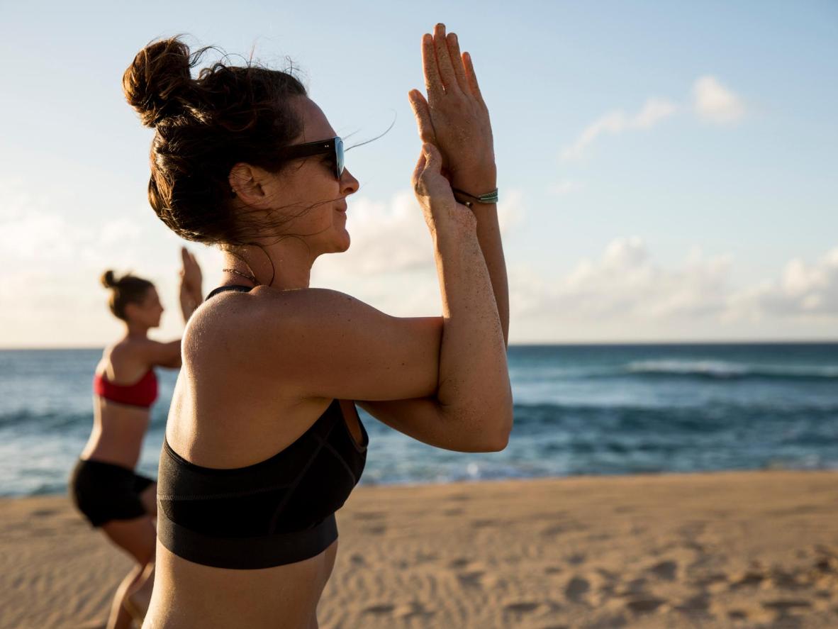 Yoga class on the beach at Paradis Plage Surf Yoga & Spa
