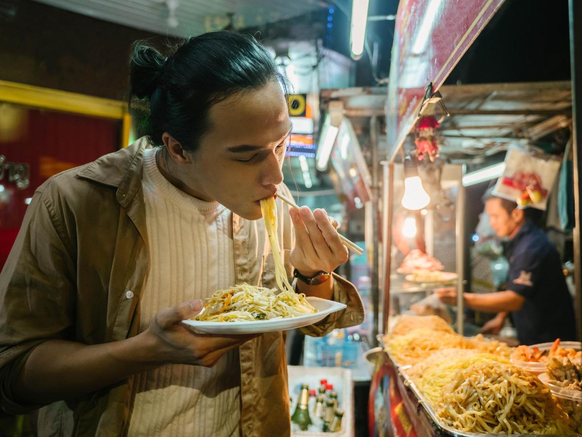 Follow your stomach through the food markets and taste local delicacies like Pad Thai noodles
