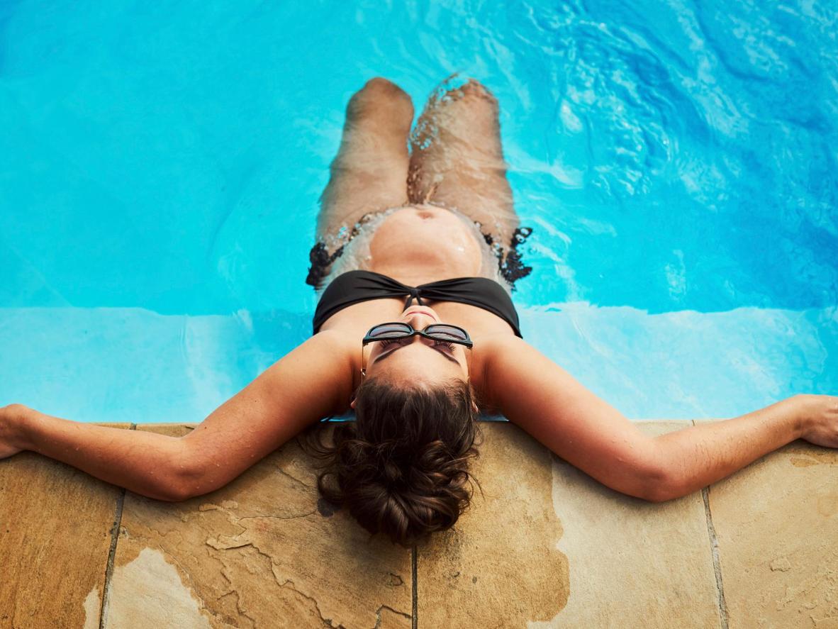 Soak up the sun by the swimming pool in Miami Beach.