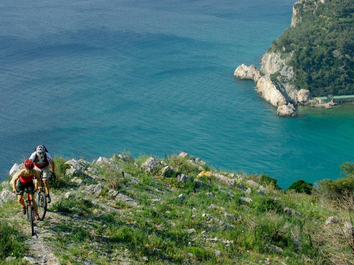 Couple biking up a mountain