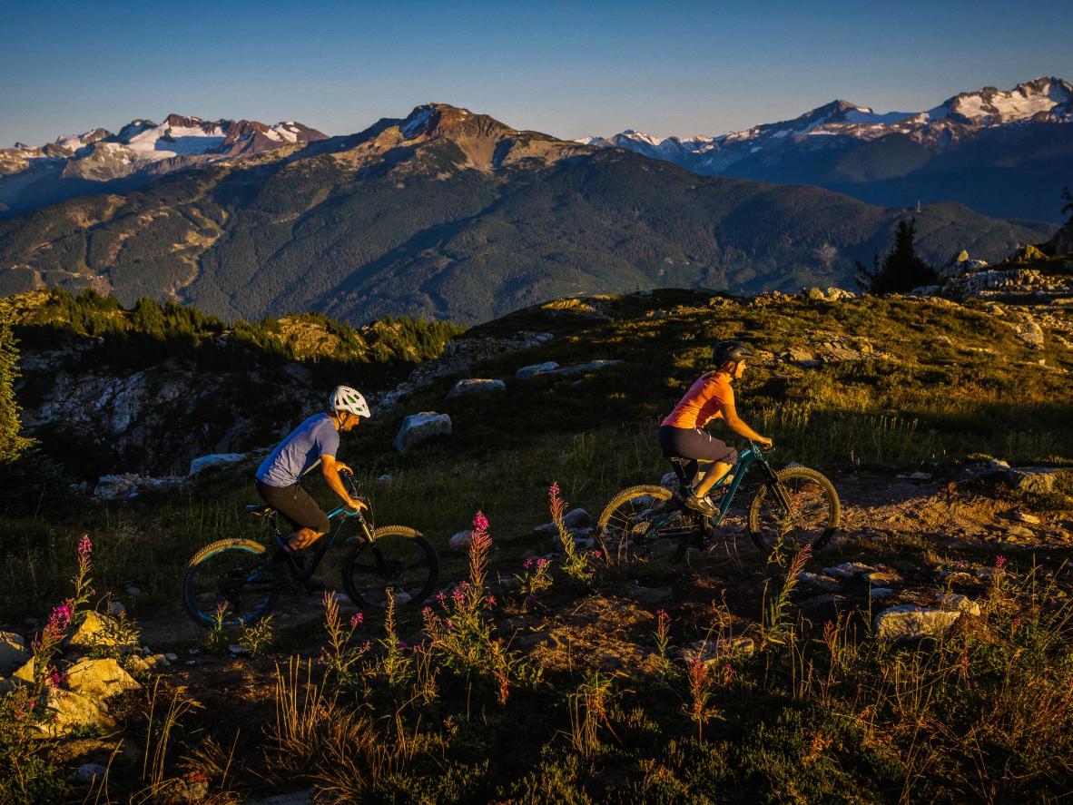 Couple mountain biking in Whistler alpine