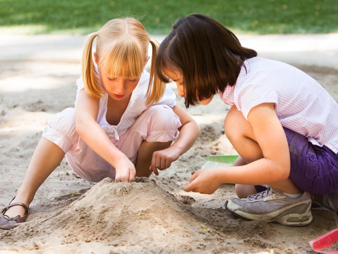 A complementary mix of golden sand and grassy picnic areas for kids to play