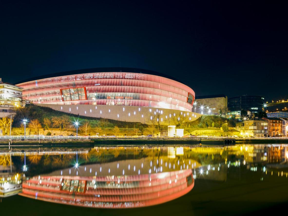 The San Mamés Stadium lights reflecting on the Nervión river