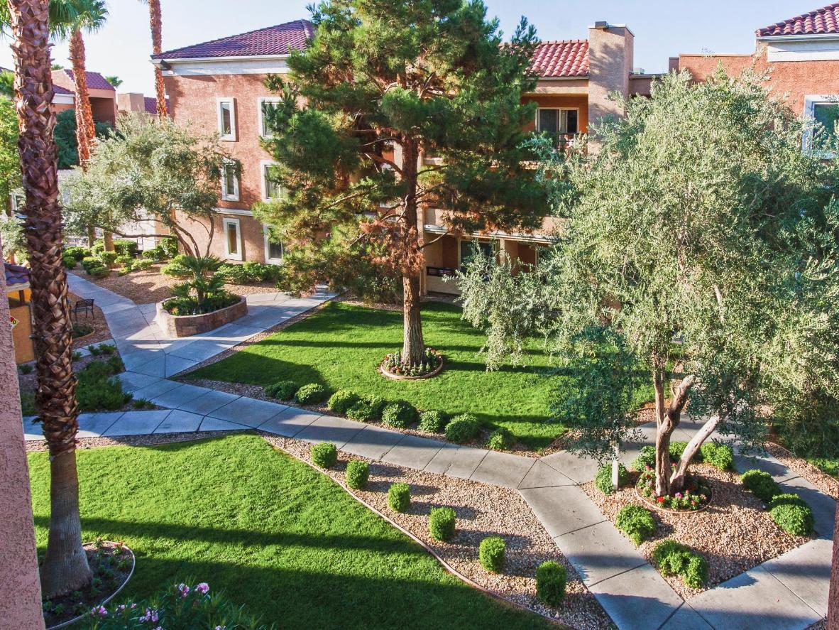 Relax in the beautiful gardens at Desert Rose Resort, just two blocks from the Strip