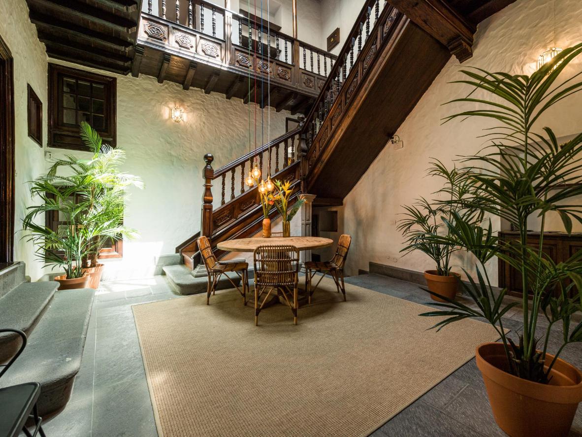 High timber beam ceilings and carved wooden doors in this historic Canary Islands villa