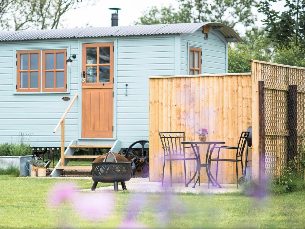 Book a painted wooden caravan with a barbecue and firepit in Yorkshire