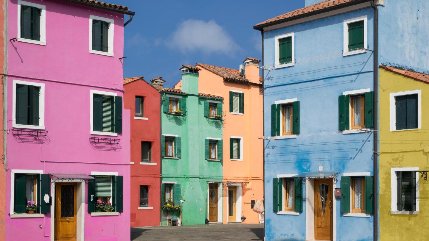 Pastel-colored houses over a channel in Burano